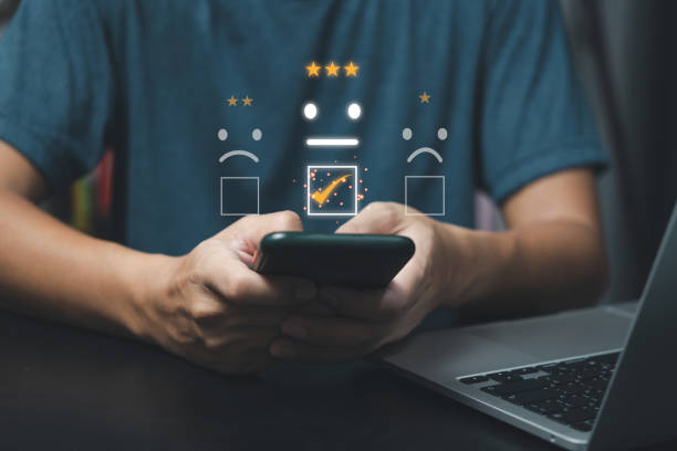 istock Customer service and Satisfaction concept Business people are touching the virtual screen on the happy Smiley face icon.Business feedback positive rating very impressed concept. 1445287666