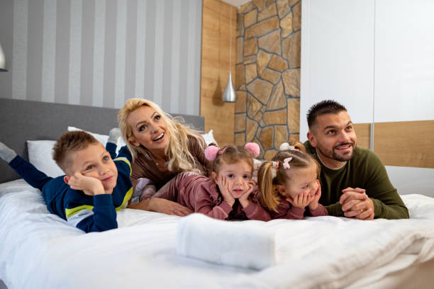 istock Happy children and their parents 1445288776