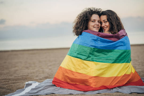istock Lesbian couple on the beach 1445288942