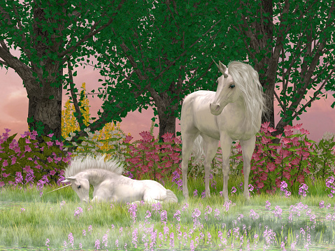 Morning mist hovers over a meadow filled with grass and flowers surrounding a Unicorn mare protecting her foal.