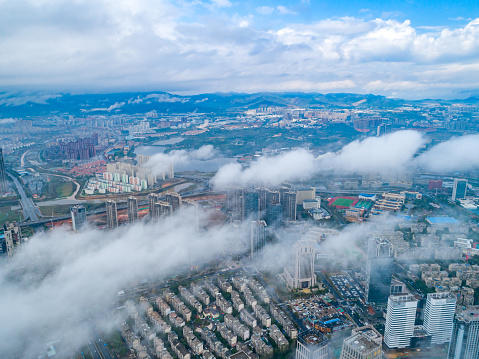 Aerial view of modern city landmarks, advection fog, Shanghai, China
