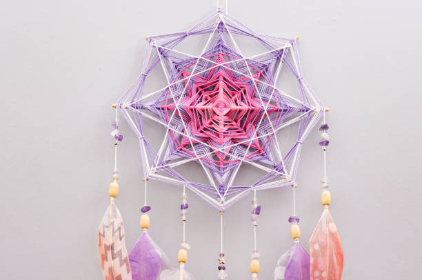 istock Esoteric woven mandala magical dreamcatcher  on grey background 1445297374