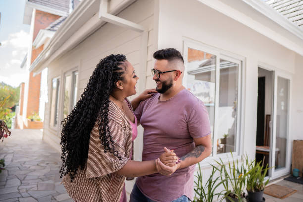 istock Happy couple dancing in their new home 1445298508