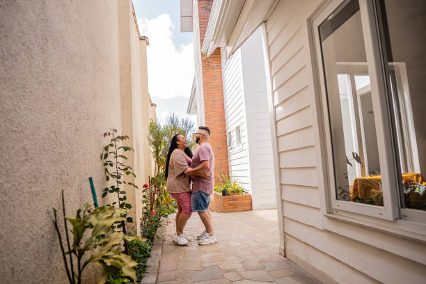 istock Happy couple dancing in their new home 1445298540
