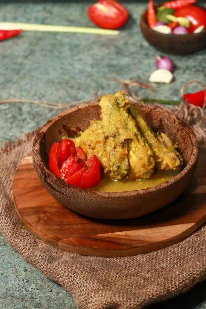 istock chicken opor with yellow sauce on a coconut bowl 1445311328