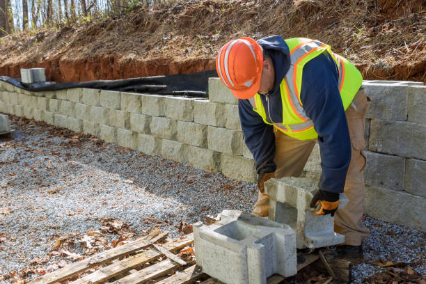 istock During the construction of a new retaining wall project, there was a contractor installing a concrete block wall that was being constructed on a portion of it 1445316366