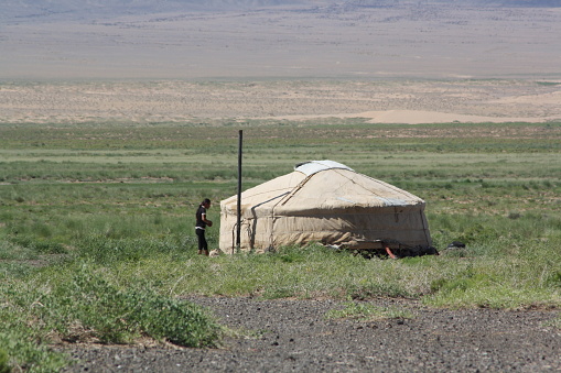 A nomadic family in the middle of nowhere, Gobi Desert in Umnugovi region, Mongolia. The family lives alone in the huge desert area. It is so hot in the afternoon, but is cooler at night.
