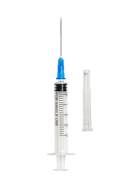 istock Syringe with protective cap isolated on white. Medical injection concept 1445325978