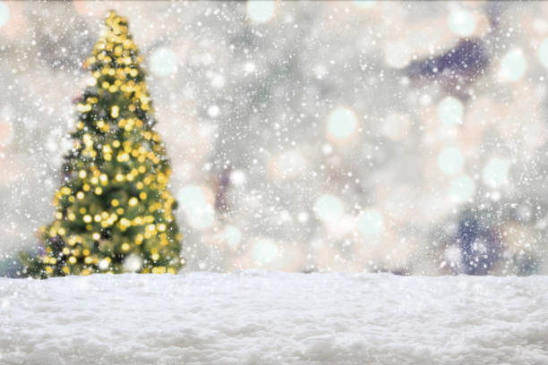 istock Empty white snow with blur Christmas tree with bokeh light background 1445327792
