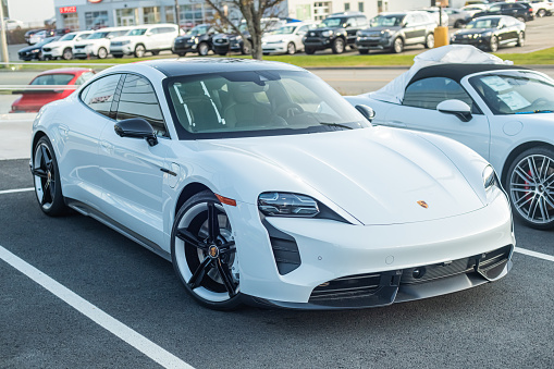 November 27, 2022 - Halifax, Canada - A 2023 Porsche Taycan GTS at a dealership. The GTS features dual electric-motor AWD, combined power: 590 hp; torque: 626 lb-ft and an estimated range 396 km.