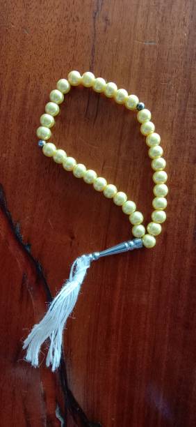 istock Prayer beads on a wooden table 1445328128