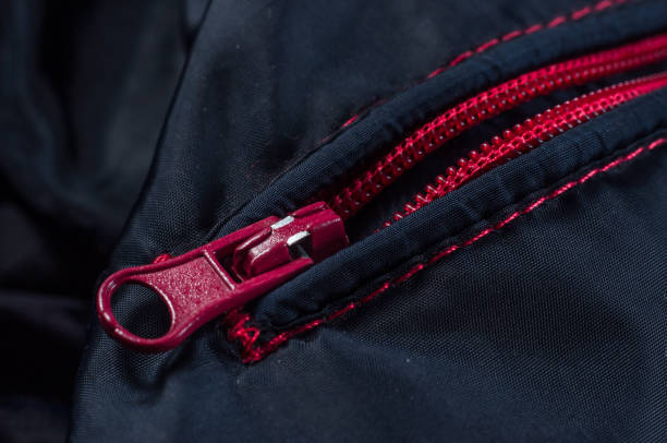 istock Red zipper clasp with lock on the bag blue, close-up 1445329762