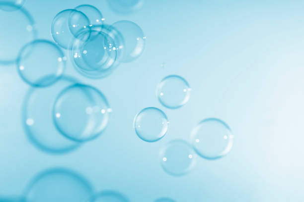 istock Abstract Transparent Blue Soap Bubbles Background. Freshness Soap Sud Bubbles Water 1445337083