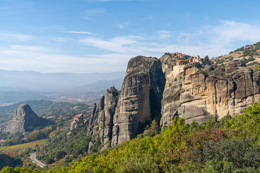 A landscape of the Meteora rock formations with the famous monasteries on the hilltops