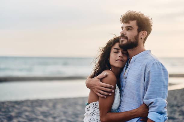 istock Young couple in love spending a day on the beach. 1445343586