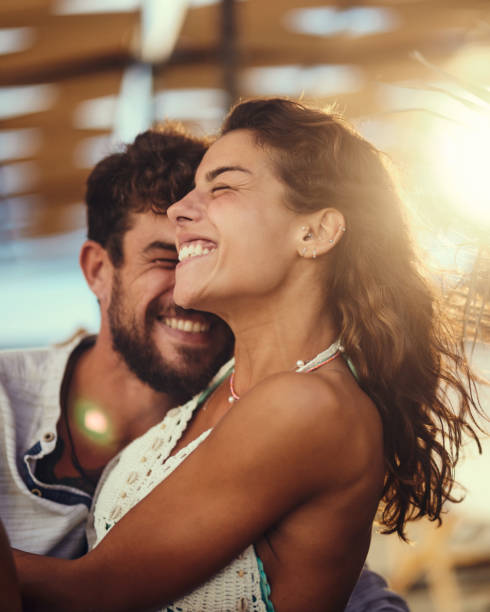 istock Young cheerful couple having fun in summer day. 1445344394