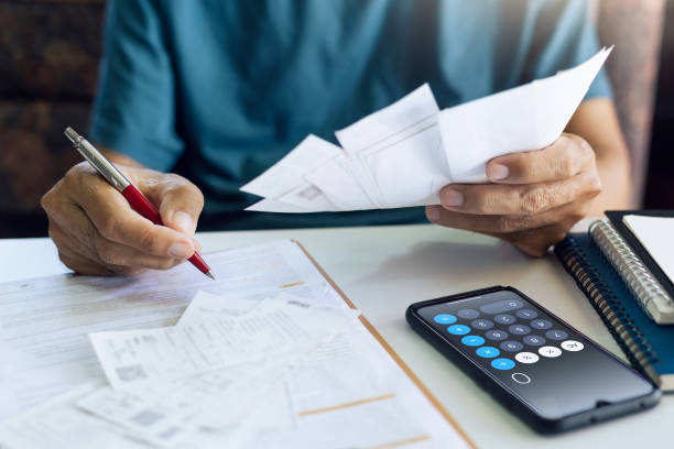istock A man calculate expenses from receipt 1445344804