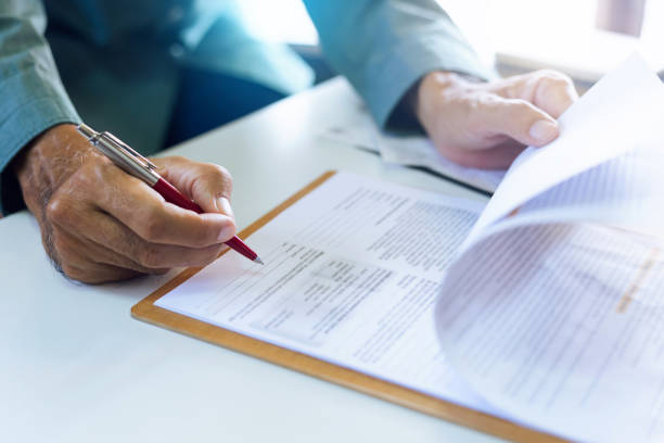 istock business people sign contract 1445344810