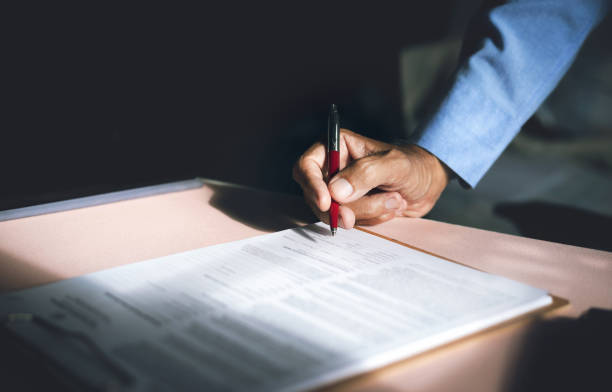 istock business people sign contract 1445344861
