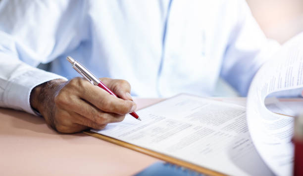 istock business people sign contract 1445344867