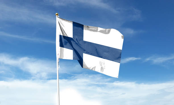 istock Finnish flag in the cloudy sky. Waving in the sky 1445346030