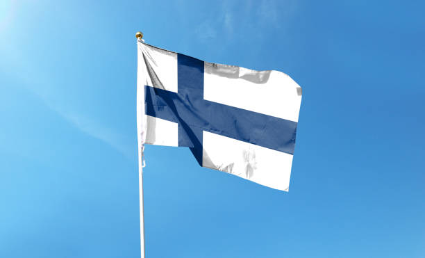 istock Finnish flag in the cloudy sky. Waving in the sky 1445346247