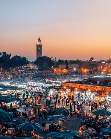 An aerial view of the Djemaa el Fna Marketplace illuminated at night