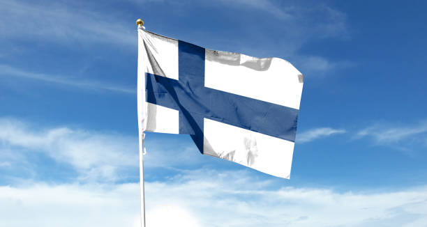 istock Finnish flag in the cloudy sky. Waving in the sky 1445347587