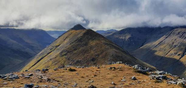 istock Mesmerizing view of mountains under a cloudy sky 1445348497