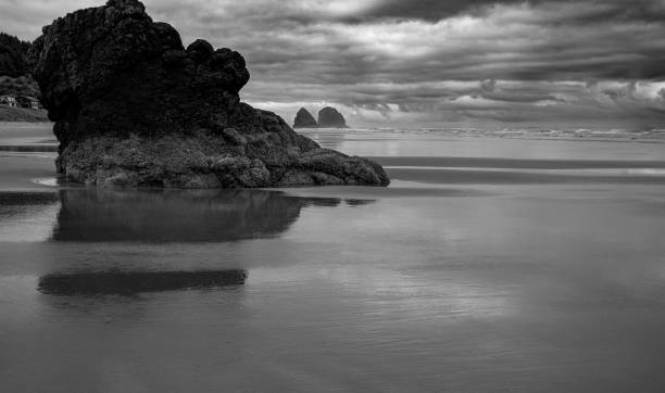 Free Stock Photo of Large Rock on Beach Under Cloudy Sky | Download ...