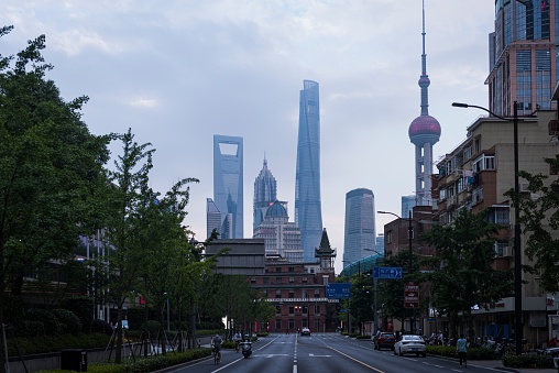 Shanghai, China – June 04, 2022: A beautiful shot of an avenue leading to the Oriental Pearl TV Tower in Shanghai, China