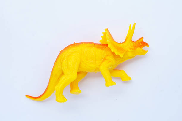 istock Plastic dinosaur toy on white background. Top view 1445355545
