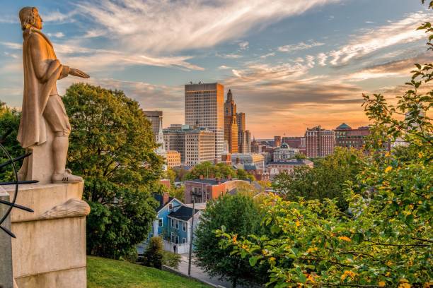 Roger Williams statue and a Providence cityscape, Rhode Island, USA