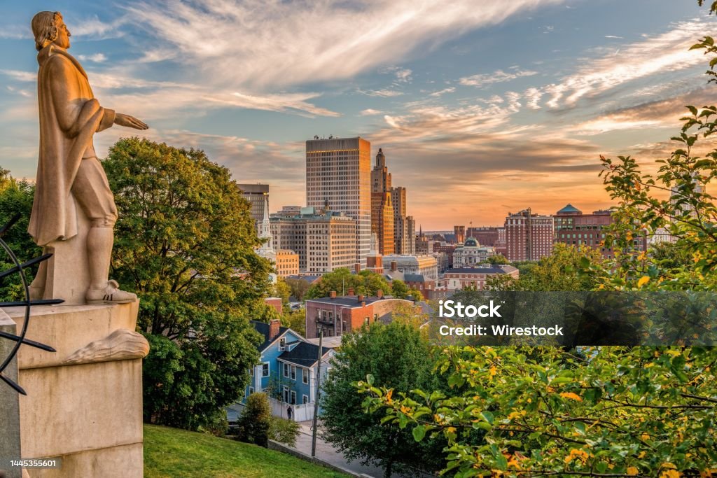 Roger Williams statue and a Providence cityscape, Rhode Island, USA A Roger Williams statue and a Providence cityscape, Rhode Island, USA Architecture Stock Photo