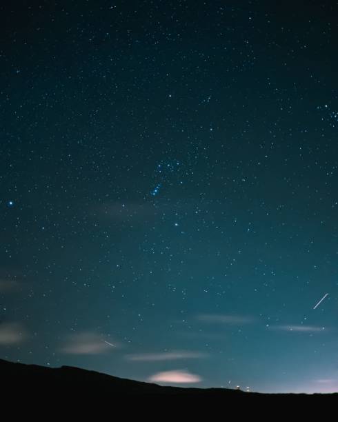 istock Vertical shot of beautiful mountains during starry night 1445355950