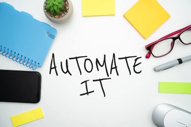 istock Flat lay office supplies layed around a text saying AUTOMATE IT  on a white background 1445357522