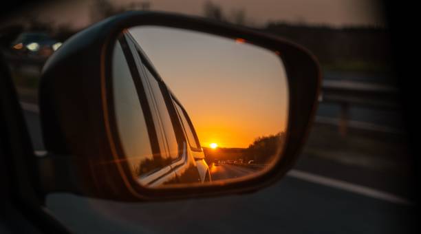 istock Sunsets reflection on the side mirror of the car 1445357861