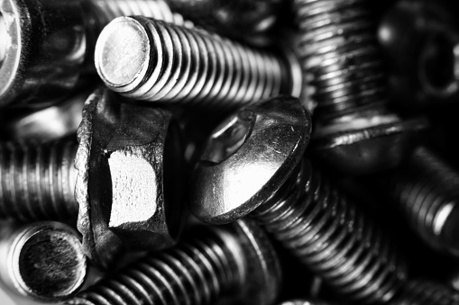 A closeup of a pile of screws