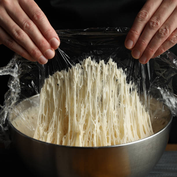 istock Yeast sourdough with air bubbles, close-up. Fermented bread dough. 1445358936