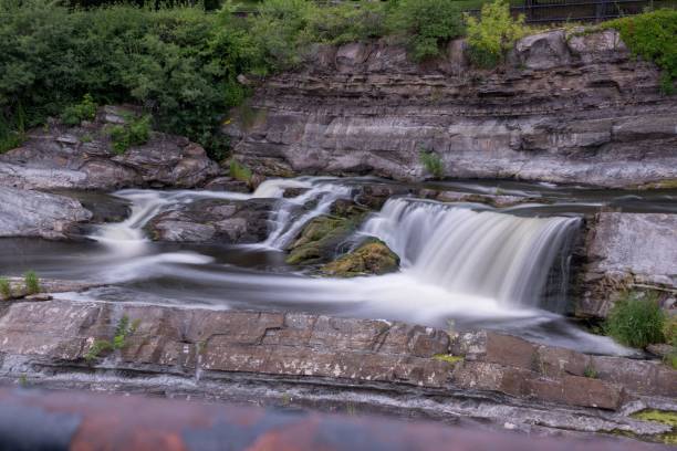 istock Long exposure of a beautiful waterfall surrounded by cliffs 1445359158