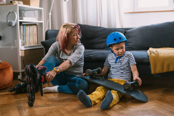istock mother and son preparing for driving skateboard and rollerblade 1445359238