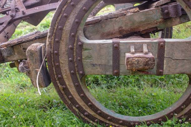 istock wooden wheel on old cart 1445359390