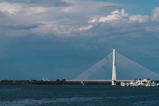 The view of Rama VIII Bridge over the river under the blue sky in Bangkok