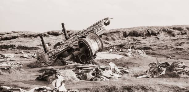 A wide shot at sunset of an old remnant of US Navy DC3  plane wreckage in Iceland wreckage of a crash from 1973, at Sólheimasandur, Iceland