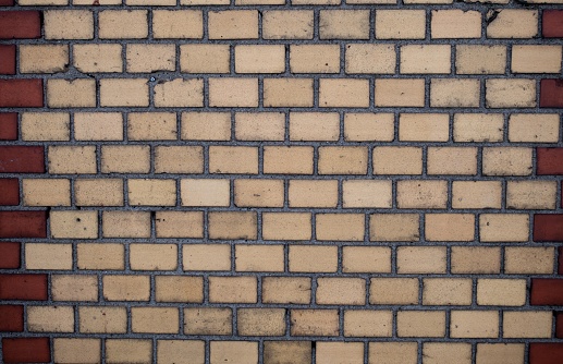 A view of a rough brick wall