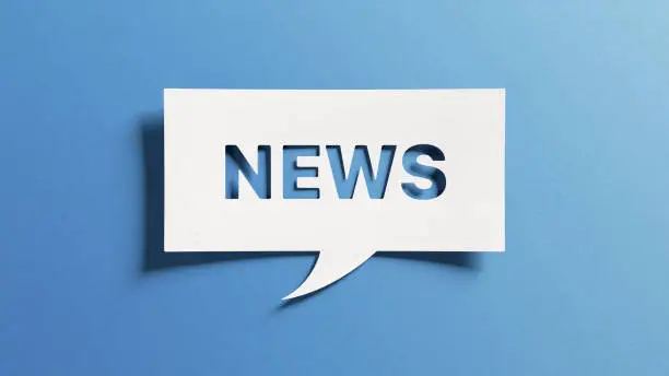 News text for newsletter, latest news, breaking news, blog website. Cut out paper speech bubble on blue background for banner, headline background. Communication on current events.