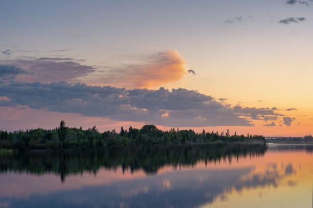 istock Beautiful sunset reflecting on the water 1445363810