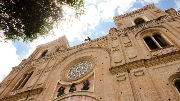 Photo of Beautiful low angle shot of The Cathedral of the Immaculate Conception in Cuenca, Ecuador