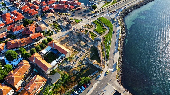 An aerial view of Nessebar cityscape surrounded by buildings and water