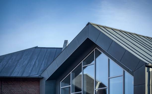 istock Modern building with glass windows against a blue sky 1445365595